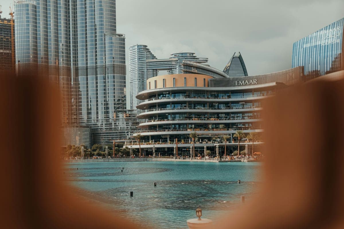Blurry photo of a city with a pool